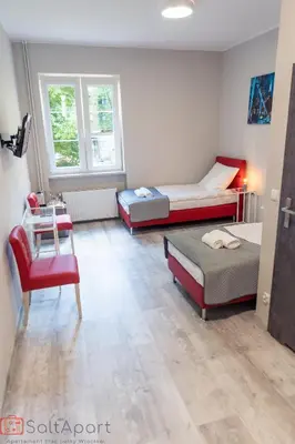 Łóżko lub łóżka w pokoju w obiekcie SaltApart Apartament Plac Solny Wrocław