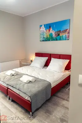 Łóżko lub łóżka w pokoju w obiekcie SaltApart Apartament Plac Solny Wrocław