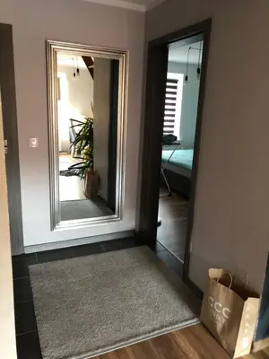 Łóżko lub łóżka w pokoju w obiekcie Apartament Moniuszki