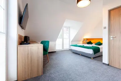 Łóżko lub łóżka w pokoju w obiekcie Willa Pod Janowcem SPORT - REST & SPA