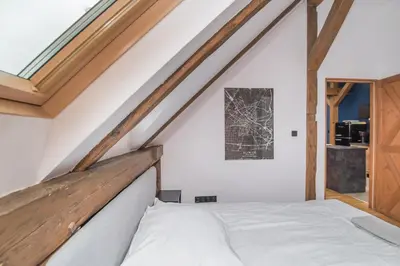 Łóżko lub łóżka w pokoju w obiekcie Uroczy Apartament Gliwice