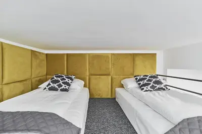 Łóżko lub łóżka w pokoju w obiekcie Apartments Wrocław Ruska by Noclegi Renters