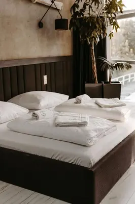 Łóżko lub łóżka w pokoju w obiekcie Apartamenty Kapitańskie - Pływające