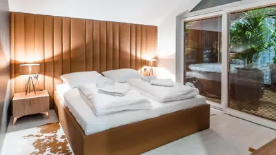 Łóżko lub łóżka w pokoju w obiekcie Apartamenty Kapitańskie - Pływające