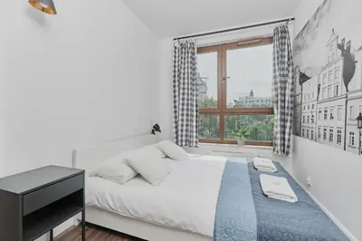 Łóżko lub łóżka w pokoju w obiekcie Apartments Odra Tower Wrocław by Noclegi Renters