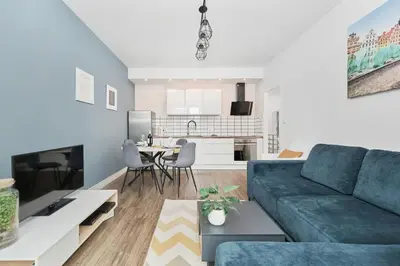 Telewizja i/lub zestaw kina domowego w obiekcie Apartments Odra Tower Wrocław by Noclegi Renters