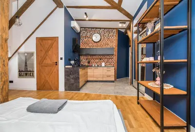 Łóżko lub łóżka w pokoju w obiekcie Przytulny Apartament Z Wieżą