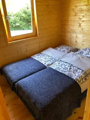 Łóżko lub łóżka w pokoju w obiekcie Chatka Uchatka