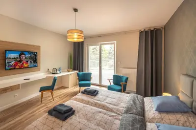 Telewizja i/lub zestaw kina domowego w obiekcie Apartamenty Mozaika - centrum Zdroju