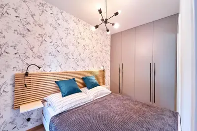 Łóżko lub łóżka w pokoju w obiekcie LAGUNA Apartament Polanica Residence 17