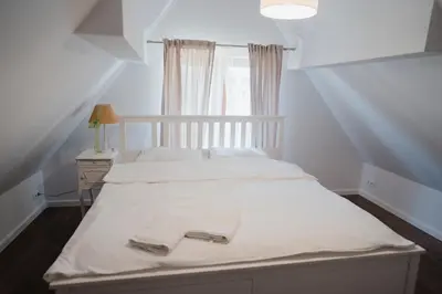 Łóżko lub łóżka w pokoju w obiekcie Tatarska Zagroda - Agroturystyka Dolina Baryczy Noclegi - Domek Danielek