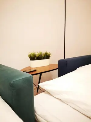 Łóżko lub łóżka w pokoju w obiekcie Apartamenty LENA 2