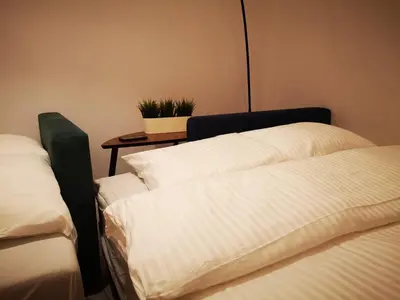 Łóżko lub łóżka w pokoju w obiekcie Apartamenty LENA 2