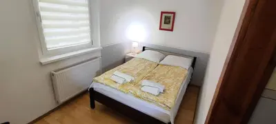 Łóżko lub łóżka w pokoju w obiekcie Apartament przy Wrocławskim Stadionie