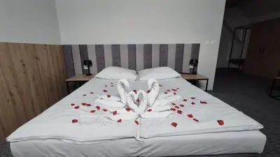 Łóżko lub łóżka w pokoju w obiekcie Hotel Wodnik
