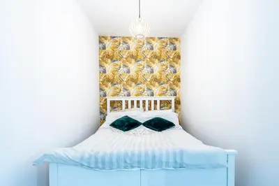 Łóżko lub łóżka w pokoju w obiekcie Apartament Uroczy