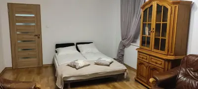 Łóżko lub łóżka w pokoju w obiekcie Apartament Niebieski
