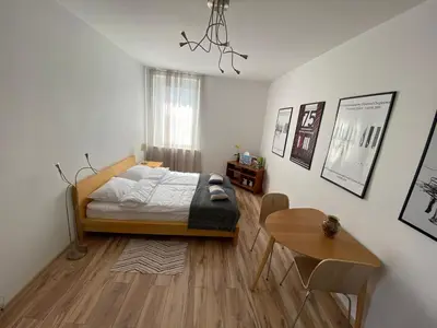 Łóżko lub łóżka w pokoju w obiekcie Apartament Niebieski