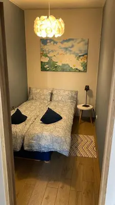 Łóżko lub łóżka w pokoju w obiekcie Apartament Niebieski