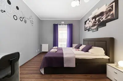 Łóżko lub łóżka w pokoju w obiekcie Apartments Wrocław Jana Pawła II with FREE PARKING Wrocław by Noclegi Renters
