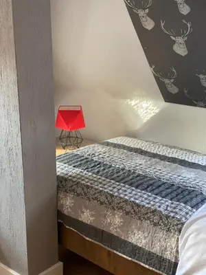 Łóżko lub łóżka w pokoju w obiekcie Zielone walizki
