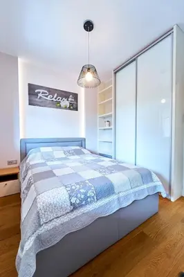 Łóżko lub łóżka w pokoju w obiekcie Apartament 26 Willa Ogrodowa