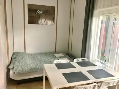 Łóżko lub łóżka w pokoju w obiekcie Szpak i Gil - domki letniskowe w Dolinie Baryczy