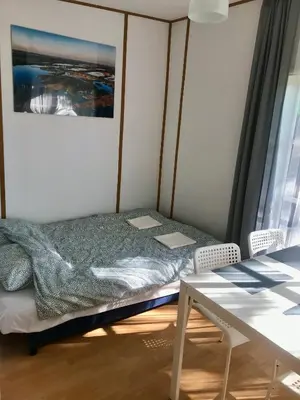 Łóżko lub łóżka w pokoju w obiekcie Szpak i Gil - domki letniskowe w Dolinie Baryczy