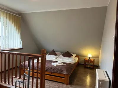 Łóżko lub łóżka w pokoju w obiekcie Apartamenty Antonio