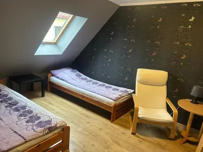 Łóżko lub łóżka w pokoju w obiekcie Apartamenty Antonio