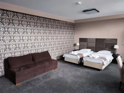 Łóżko lub łóżka w pokoju w obiekcie Hotel Jedlinka