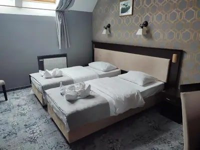 Łóżko lub łóżka w pokoju w obiekcie Hotel Jedlinka