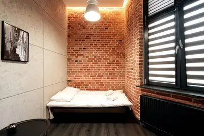 Łóżko lub łóżka w pokoju w obiekcie Piłsudskiego48