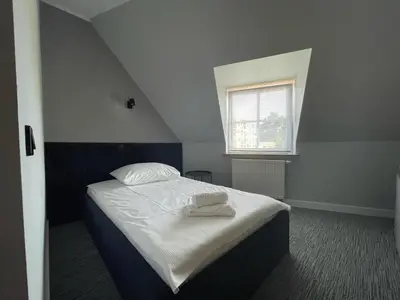 Łóżko lub łóżka w pokoju w obiekcie Hotel Made in Napoli by Siervo Międzybórz