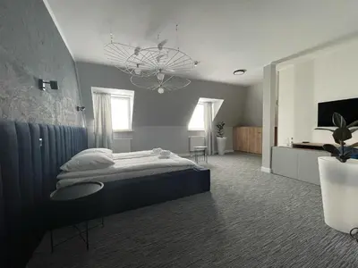 Łóżko lub łóżka w pokoju w obiekcie Hotel Made in Napoli by Siervo Międzybórz