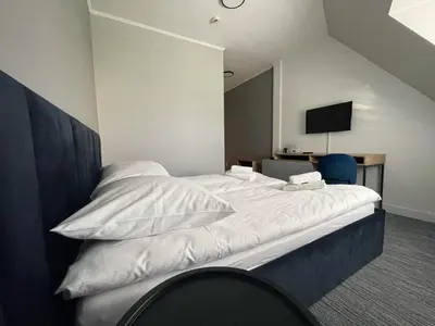 Łóżko lub łóżka w pokoju w obiekcie Hotel Made in Napoli by Siervo Międzybórz