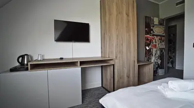 Łóżko lub łóżka w pokoju w obiekcie Hotel Made in Napoli by Siervo Międzybórz