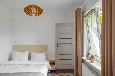 Łóżko lub łóżka w pokoju w obiekcie Apartament AUGUSTYN