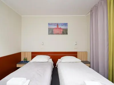 Łóżko lub łóżka w pokoju w obiekcie Aqua-Zdrój