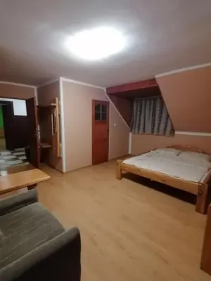 Łóżko lub łóżka w pokoju w obiekcie Pokoje Gościnne Alexandra