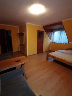 Łóżko lub łóżka w pokoju w obiekcie Pokoje Gościnne Alexandra