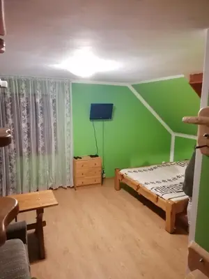 Łóżko lub łóżka w pokoju w obiekcie Pokoje Gościnne Alexandra
