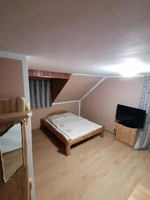 Łóżko lub łóżka w pokoju w obiekcie Pokoje Gościnne Alexandra