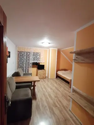 Łóżko lub łóżka w pokoju w obiekcie Pokoje Gościnne Alexandra