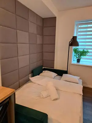 Łóżko lub łóżka w pokoju w obiekcie Apartamenty LENA 1