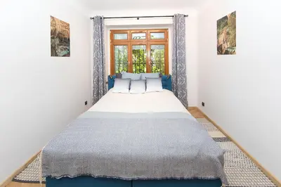 Łóżko lub łóżka w pokoju w obiekcie Apartamenty Stara Apteka