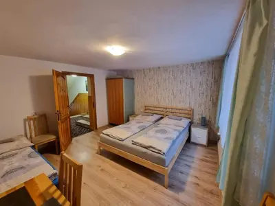 Łóżko lub łóżka w pokoju w obiekcie Willa Słoneczko