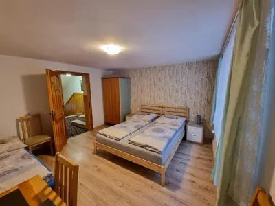 Łóżko lub łóżka w pokoju w obiekcie Willa Słoneczko