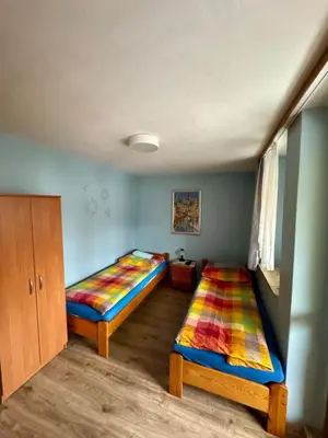 Łóżko lub łóżka w pokoju w obiekcie Willa Słoneczko