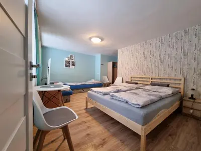 Łóżko lub łóżka w pokoju w obiekcie Willa Słoneczko
